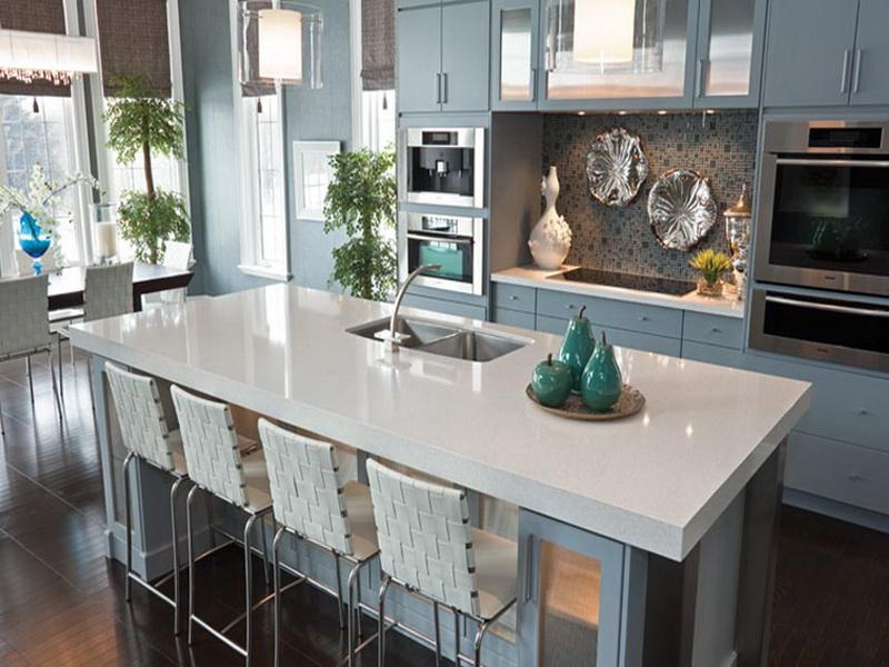 Designer Kitchen featuring an island with a white quartz kitchen countertop